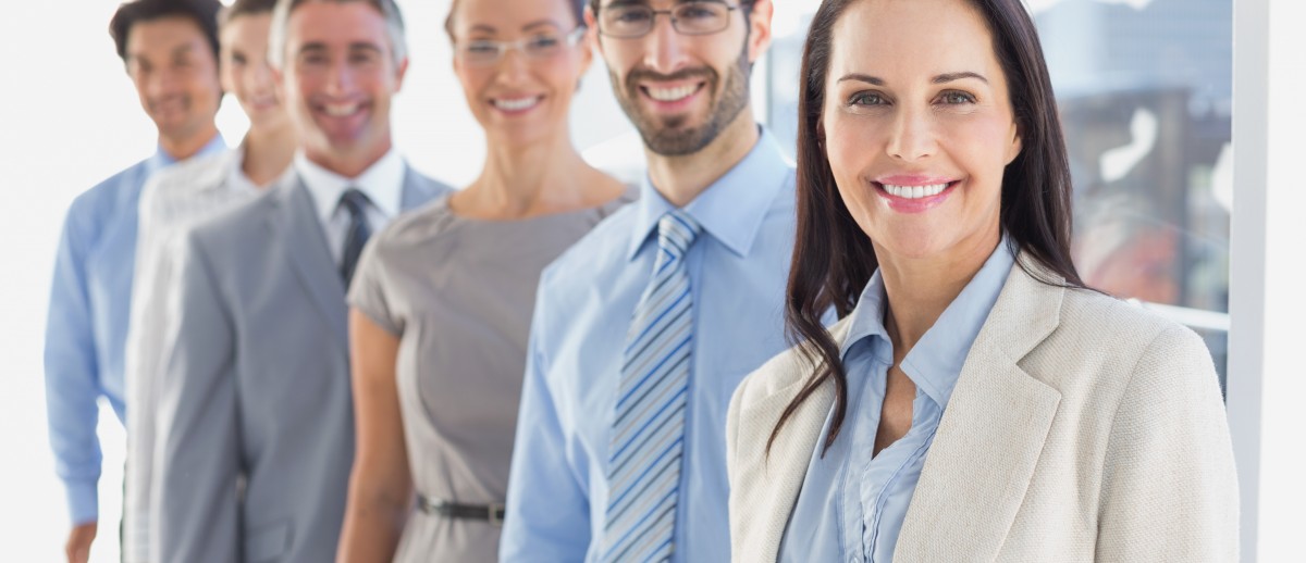 Smiling employee's in a line at work