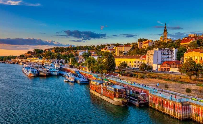 Sunset over Belgrade and ships in the harbor. HDR image