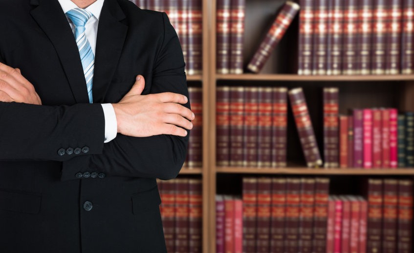 Midsection Of Lawyer With Arms Crossed