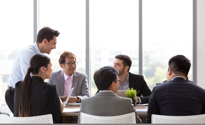 Chief businessman standing at conference table during team meeting, Entrepreneurs making deal starting collaboration at group negotiations teamwork